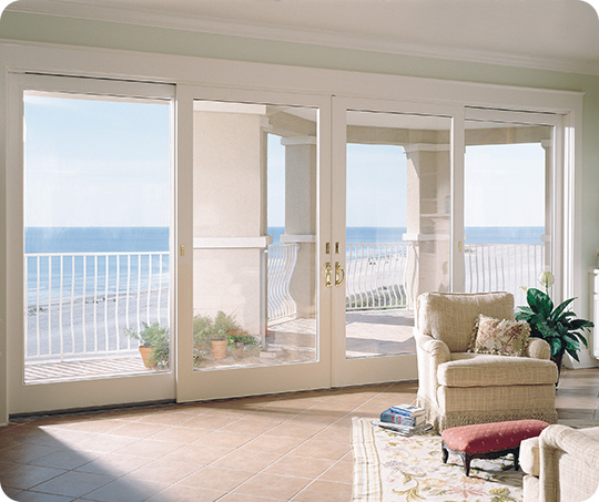 white frenchwood gliding patio door overlooking a beach