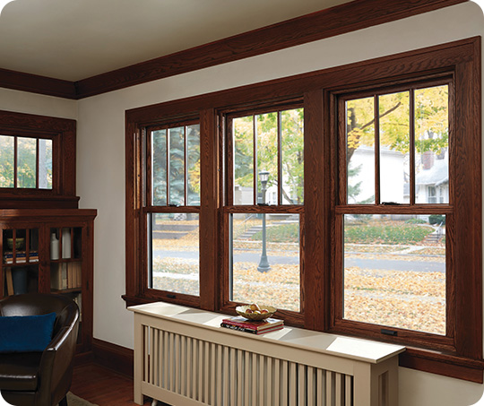 dark brown wood double hung windows in the andersen 400 series