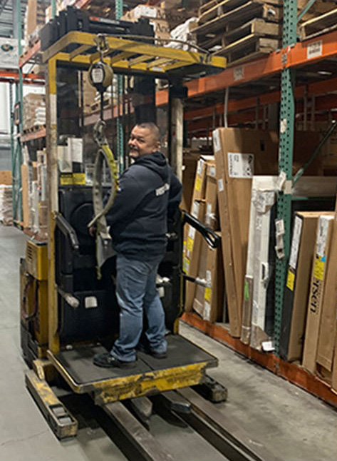 windowrama employee riding a forklift