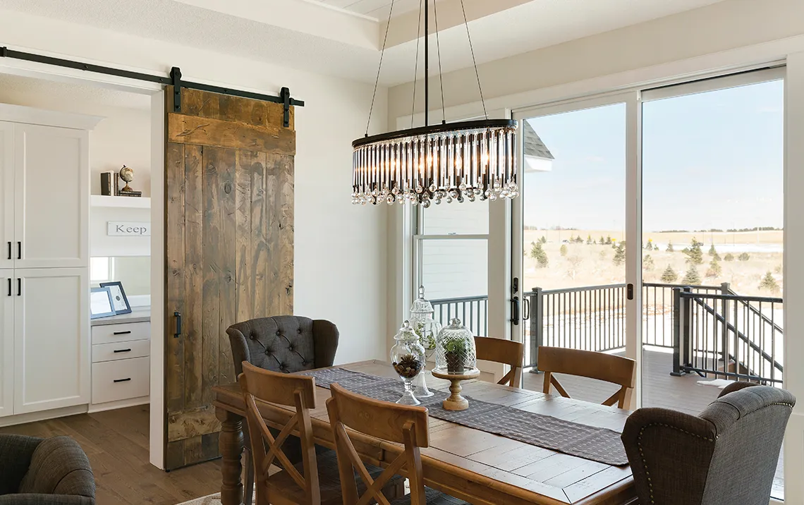 kitchen with wood floors and furniture and a wooden interior sliding door