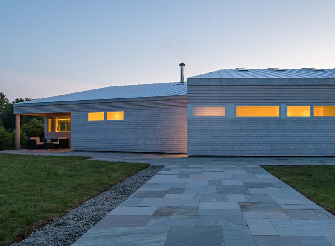 A modern house exterior walkway with rectangle awning windows