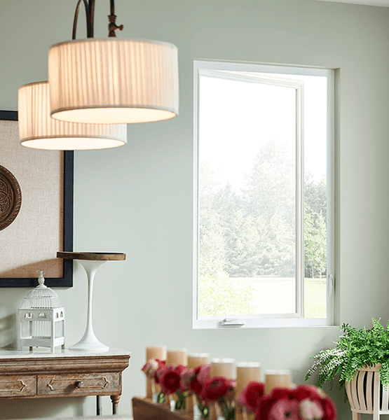 casement window on a light green wall