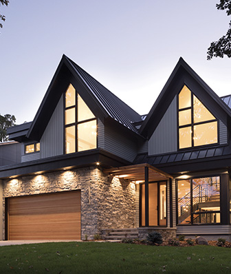 house exterior with a brick bottom and a steel gray upper half
