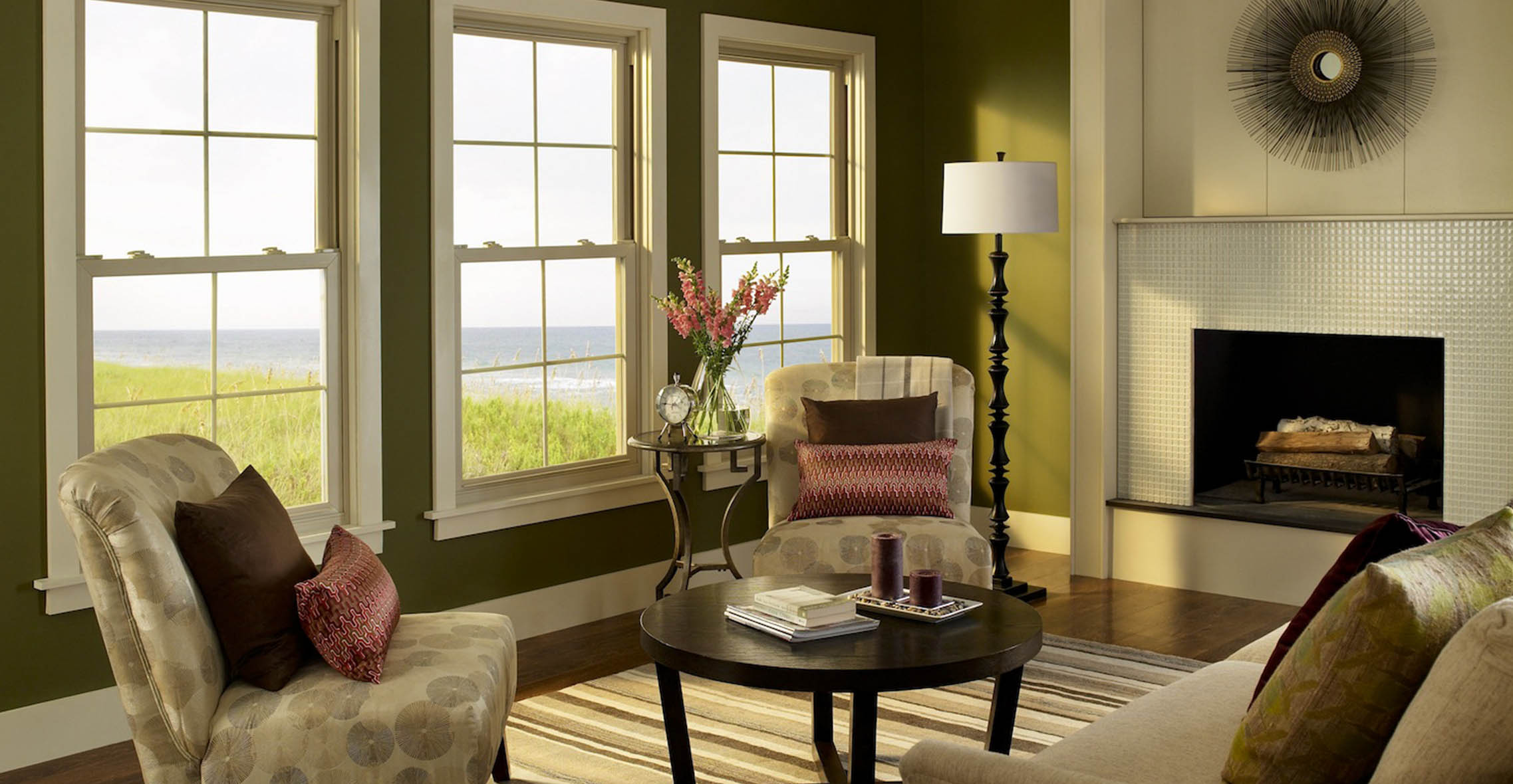 Double hung windows inside a living room with a fireplace