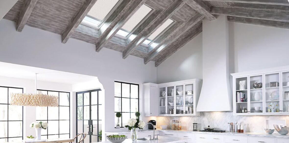 white kitchen space with minimalistic design featuring velux skylights