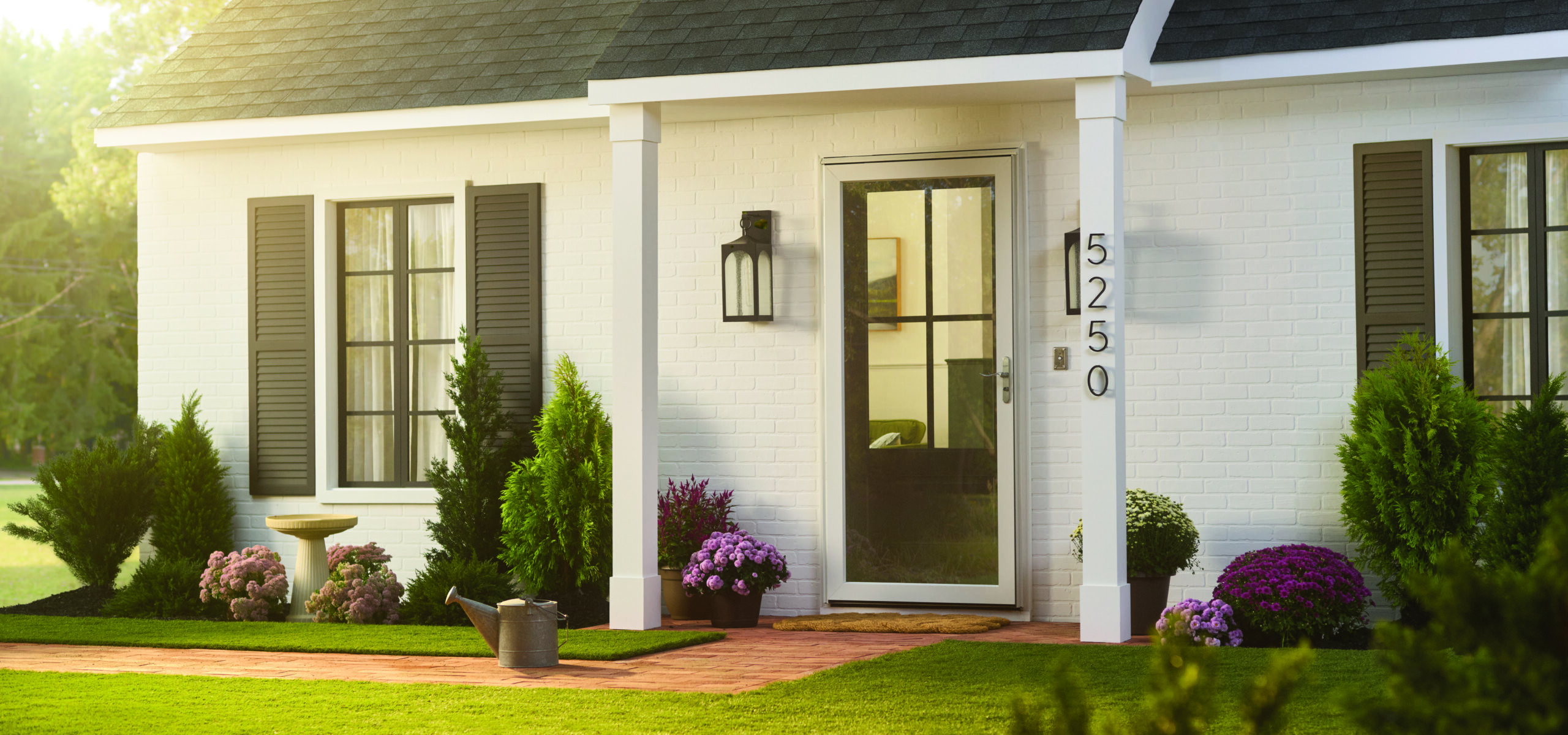 front door and windows on a white suburban ranch style home