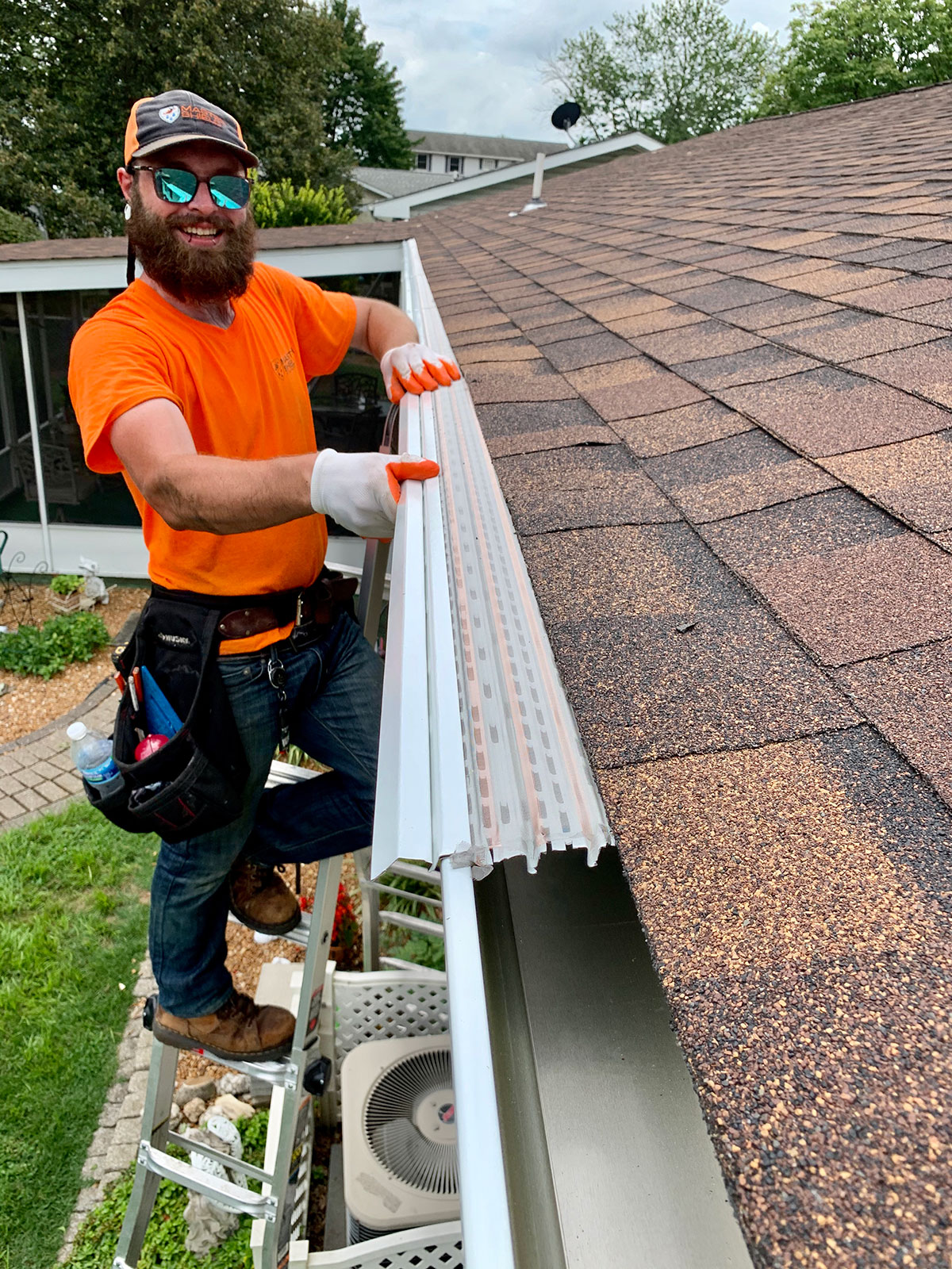 mastershield gutter guard installer placing new gutter guards