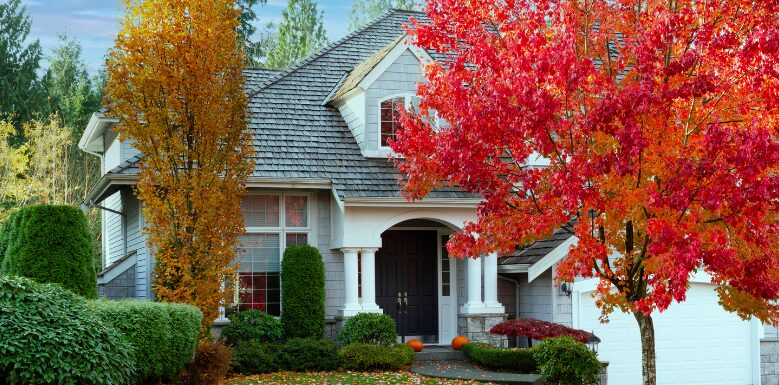 white home behind fall foliage trees