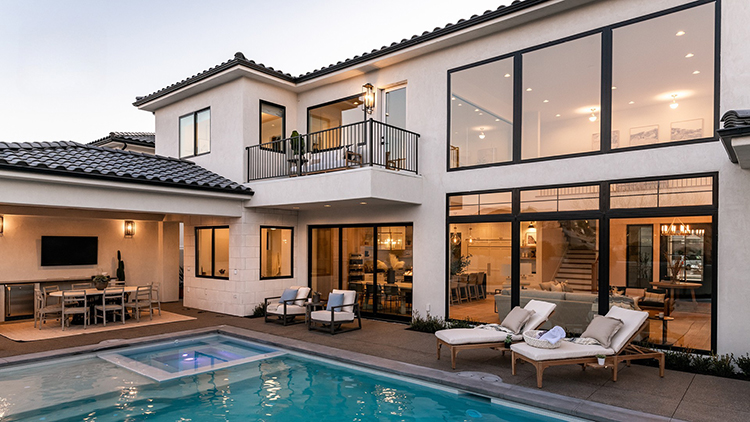 Modern sliding patio doors connecting a home interior to a backyard patio