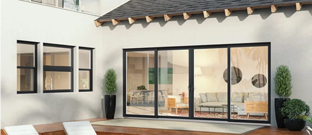 Four-panel vinyl sliding patio door opening a living space to a backyard patio